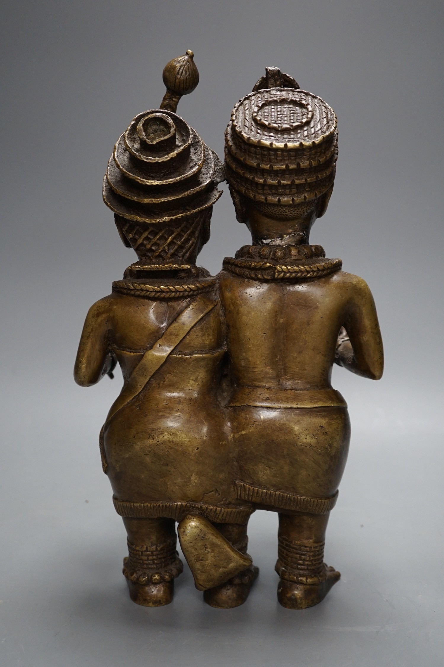 A Benin style bronze twin figure group, 33cm